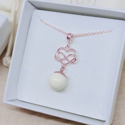 Collier avec pendentif coeur et infini entrelacés doré à l'Or rose et perle contenant votre lait maternel et/ou mèches de cheveu